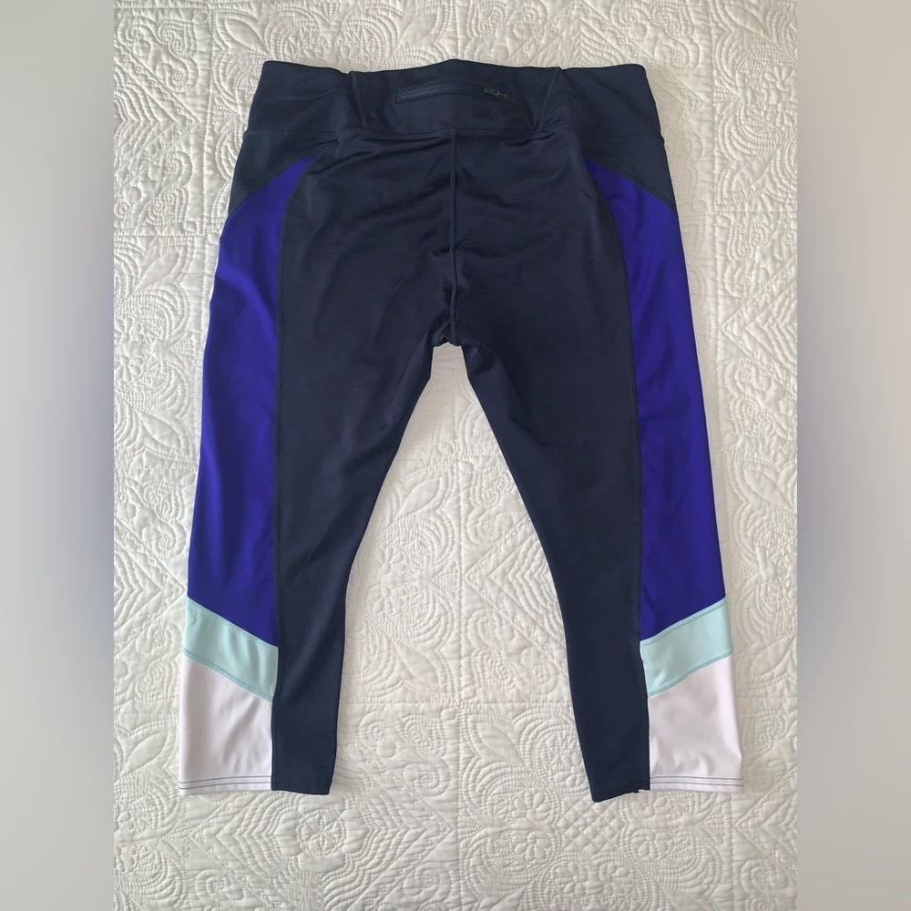 Athleta black leggings with color block accents never worn, size XL.